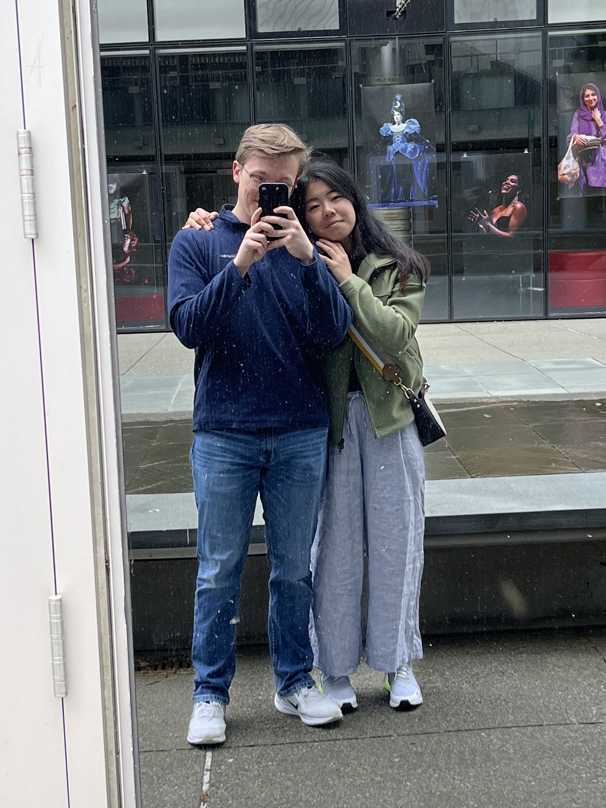 Angela and Aidan taking a mirror photo in Seattle